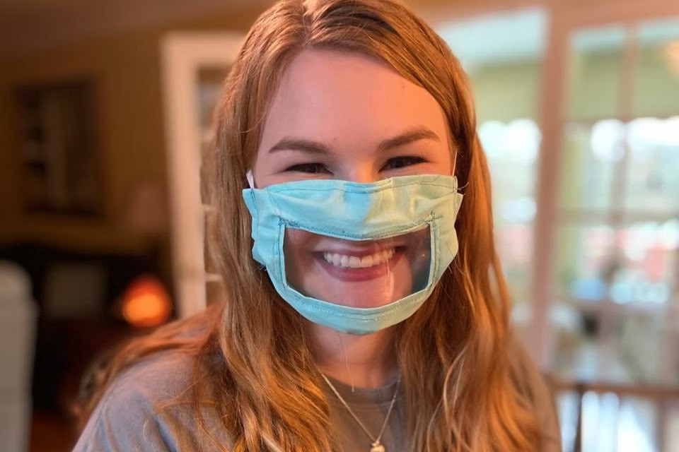woman wears a see through mask
