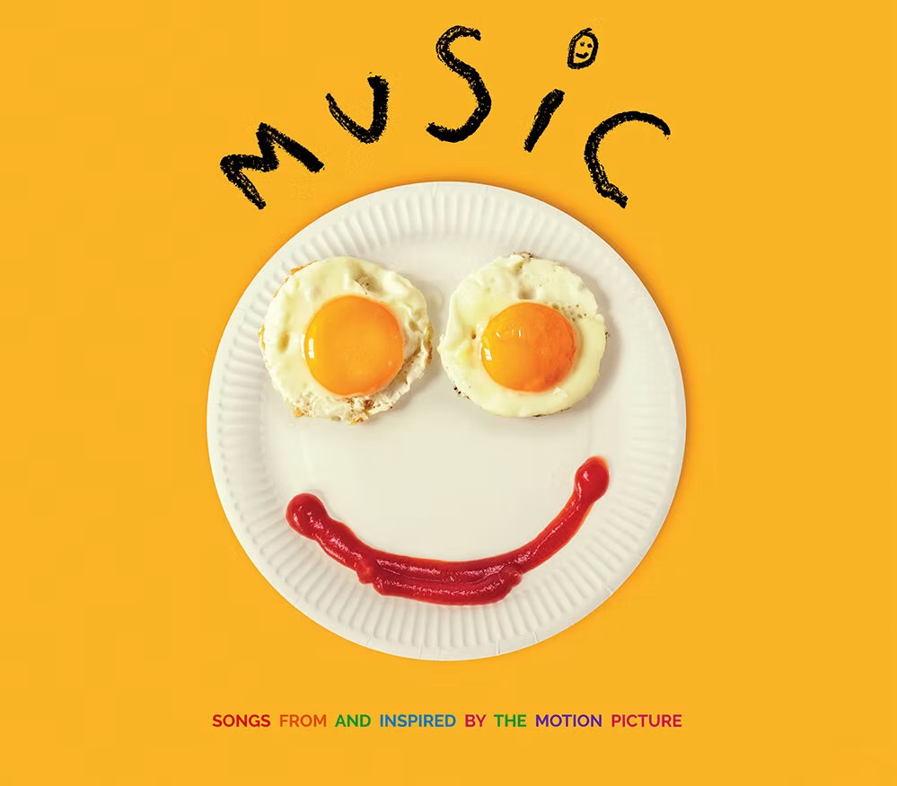 Sia music film graphic , two sunny eggs, a sausage on a pancake which makes a smile on a yellow background